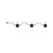 Trois lampes LED noires avec diffuseurs blancs sur câble flexible pour éclairage intérieur moderne