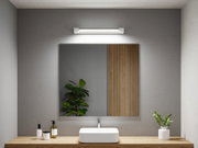 Modern bathroom with white sink, wooden countertop and LED mirror light on grey wall