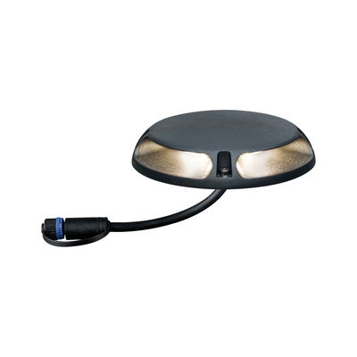 Round black LED ground recessed light with warm white glow and cable connection for outdoor lighting