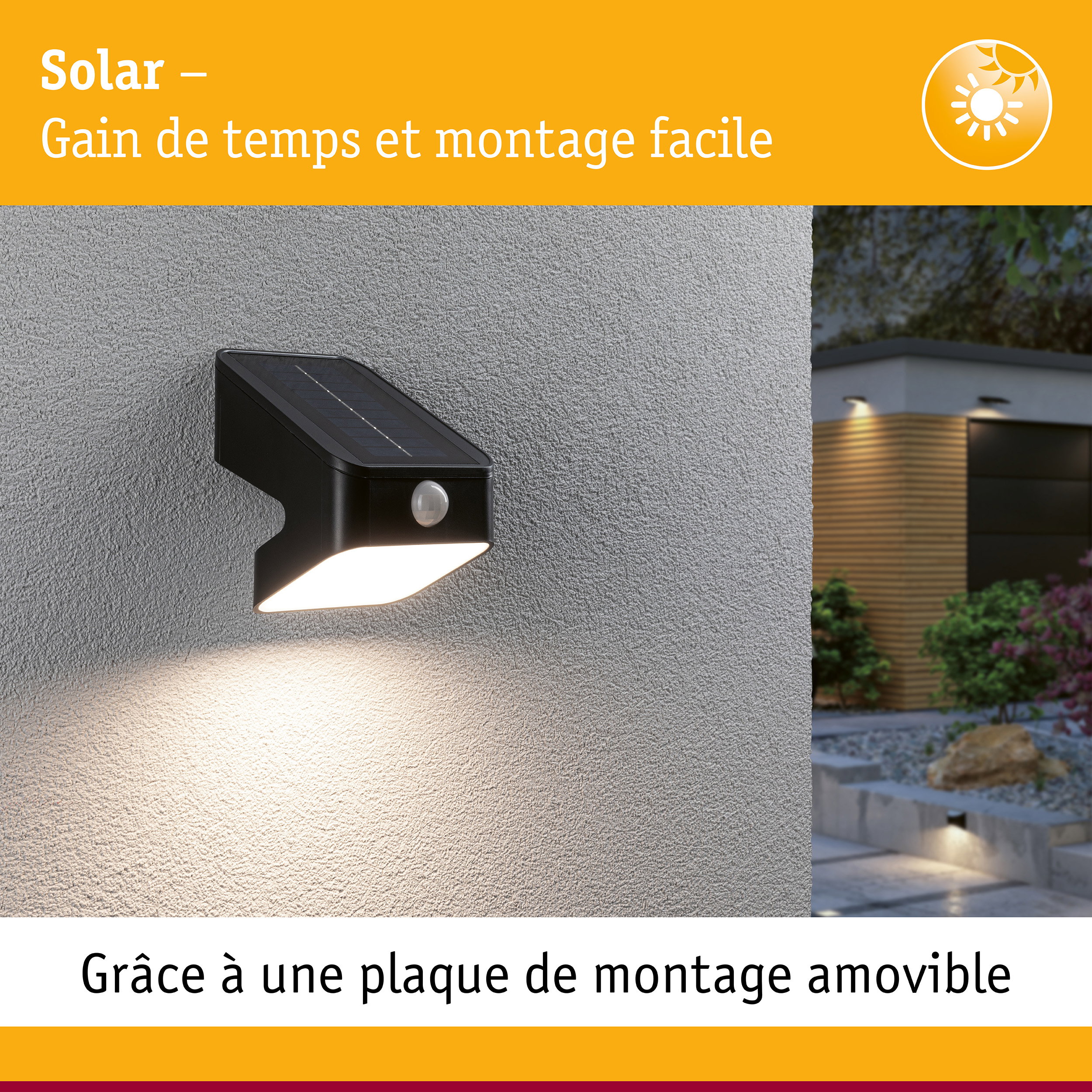 Applique murale solaire noire avec détecteur de mouvement sur mur gris éclairant un chemin de jardin au crépuscule