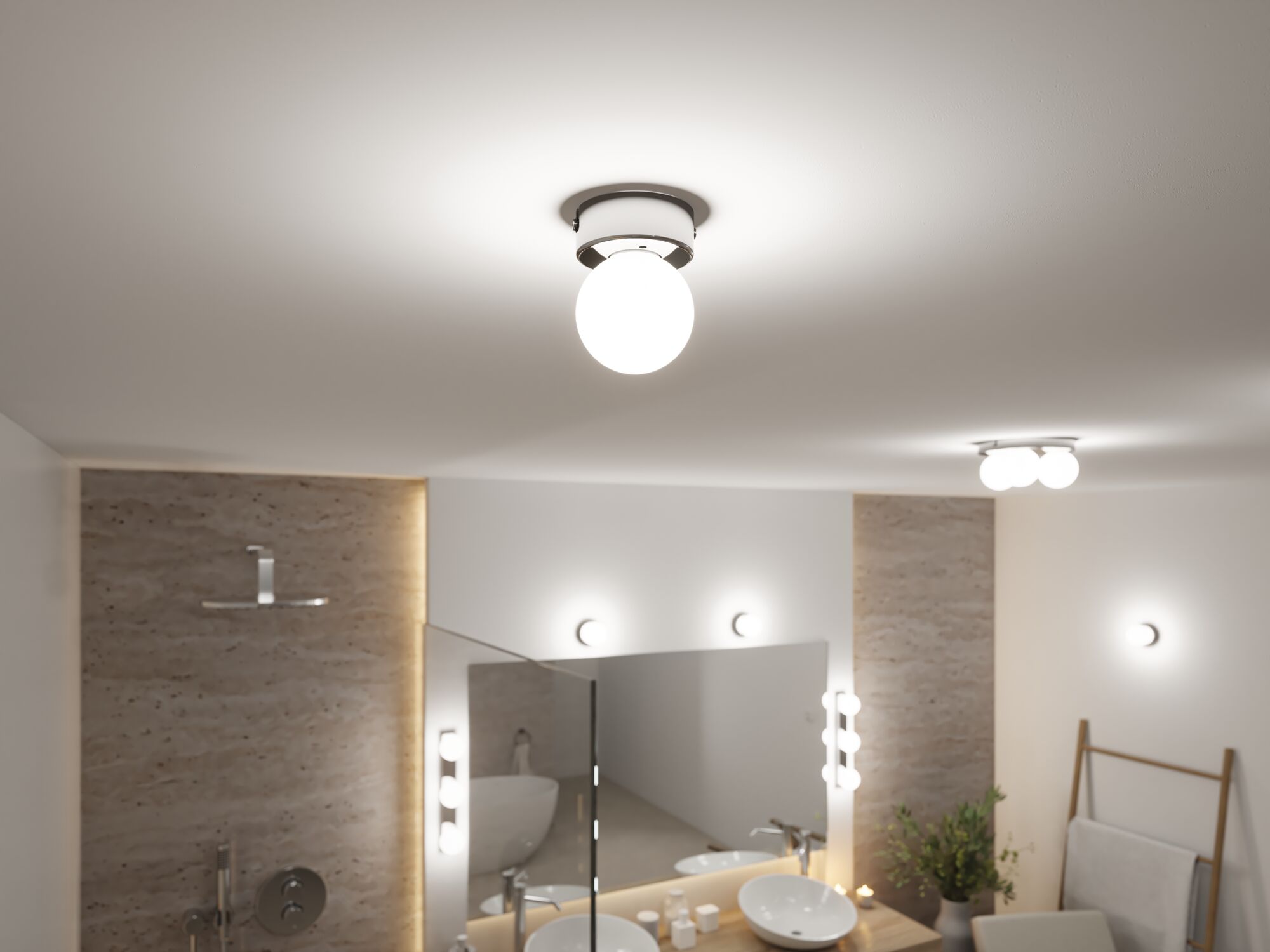Rund loftlampe med hvidt glas og metalramme i moderne badeværelse med spejl og håndvask.