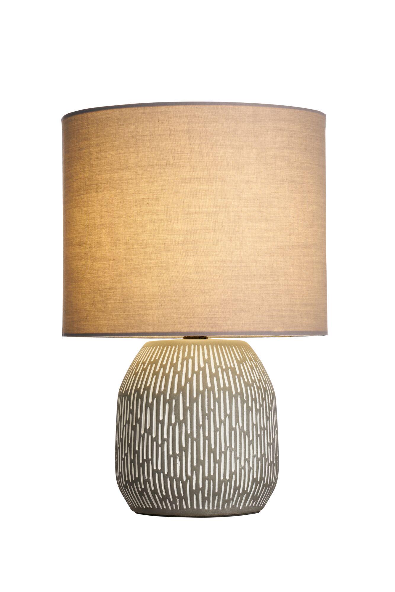Ceramic table lamp with beige fabric shade and decorative pattern for ambient lighting