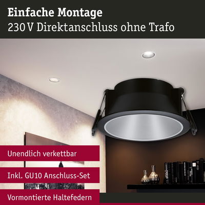 Schwarzer Einbaustrahler mit silbernem Reflektor und vormontierten Haltefedern für 230V Direktanschluss