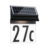 Black solar house number sign with illuminated white panel and large black digits 27c