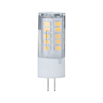 Small LED lamp with transparent plastic housing and two metal pins for energy-saving lighting