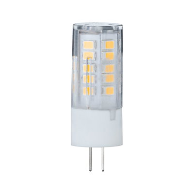 Small LED lamp with transparent plastic housing and two metal pins for energy-saving lighting