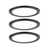 Three round black LED recessed lights with white illumination for modern indoor lighting.