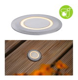 Round LED recessed light in brushed aluminum with warm white light for outdoor use.