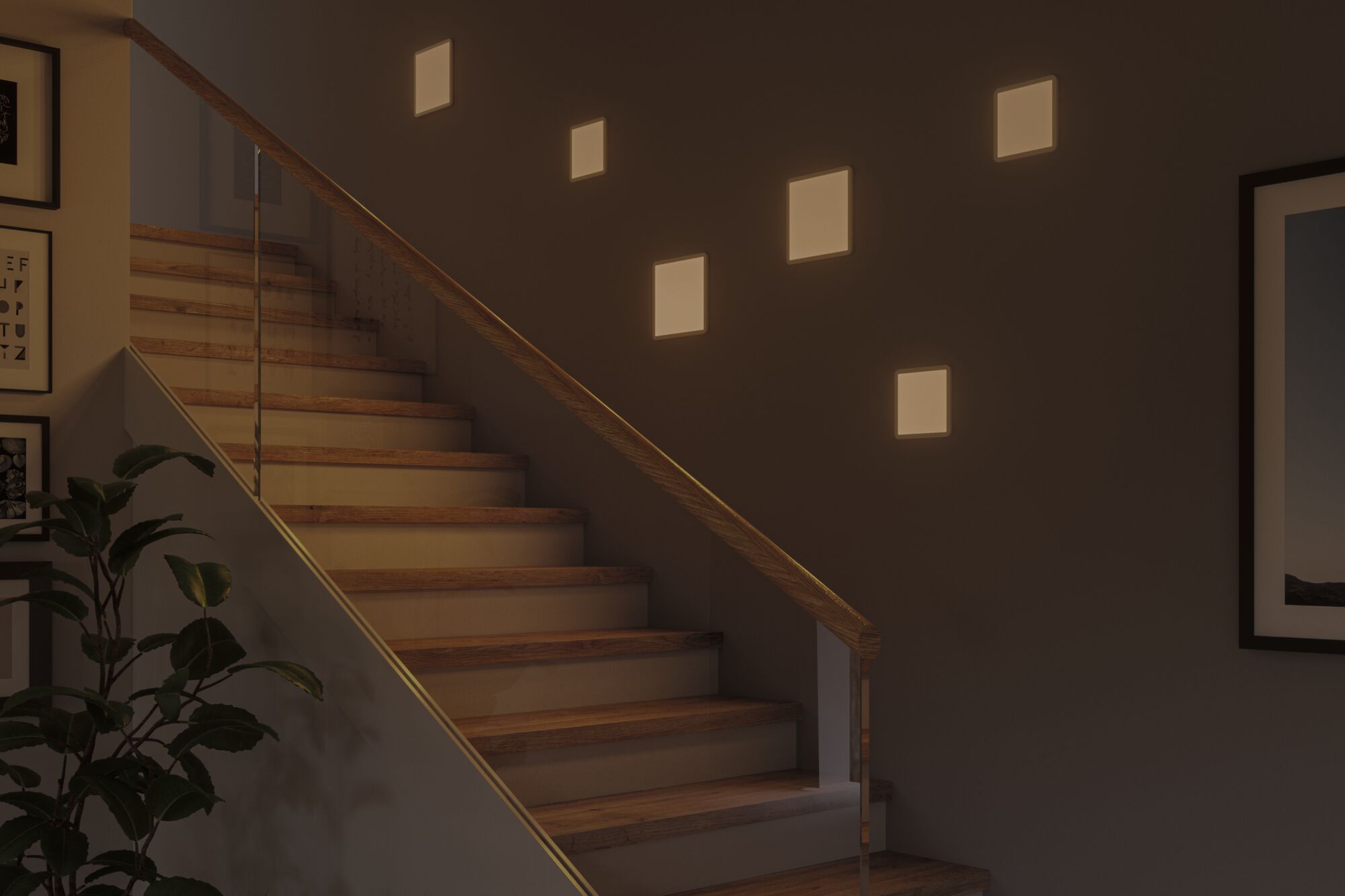 Modern staircase with wooden steps and glass railing lit by warm white square wall lights