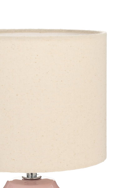 Beige fabric lampshade with fine texture on pink ceramic base for ambient room lighting
