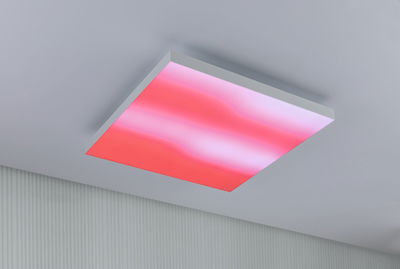 Square LED ceiling light with white frame and red illumination for modern interiors