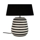 Table lamp with black and white striped ceramic base and black fabric shade for living spaces
