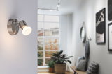 Modern silver brushed metal LED wall spotlight ideal for stylish home lighting