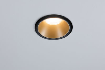 Round recessed light with black frame and gold reflector for modern LED ceiling lighting