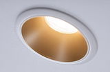 White recessed light with gold reflector providing warm LED ceiling illumination
