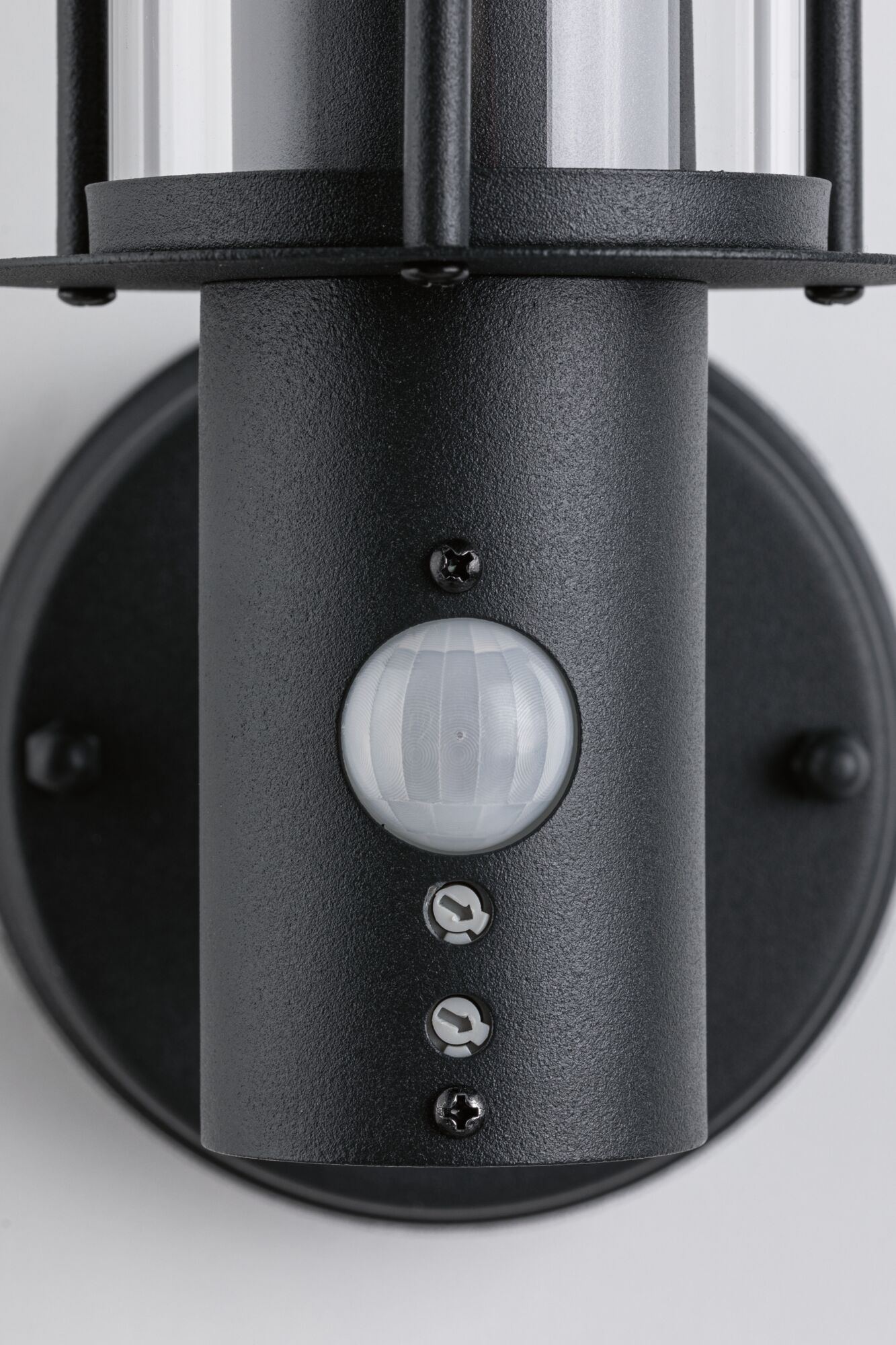 Black metal outdoor wall light with motion sensor and clear glass for modern exterior lighting.