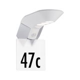 Modern white LED house number light with motion sensor and clear acrylic plate for outdoor use.