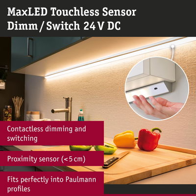 MaxLED touchless sensor for dimming and switching 24 V DC in kitchen lighting with fresh peppers on cutting board.