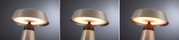 Dreiteiliges Bild einer modernen Tischlampe aus beige lackiertem Metall mit warmweißem Licht