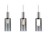 Three modern pendant lights with smoked glass and chrome metal for stylish indoor lighting.