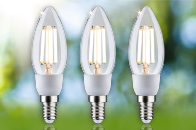 Three clear LED candle bulbs with E14 base emitting warm white light for energy-efficient lighting.