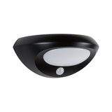 Black LED wall light with white diffuser and motion sensor for energy-efficient outdoor lighting