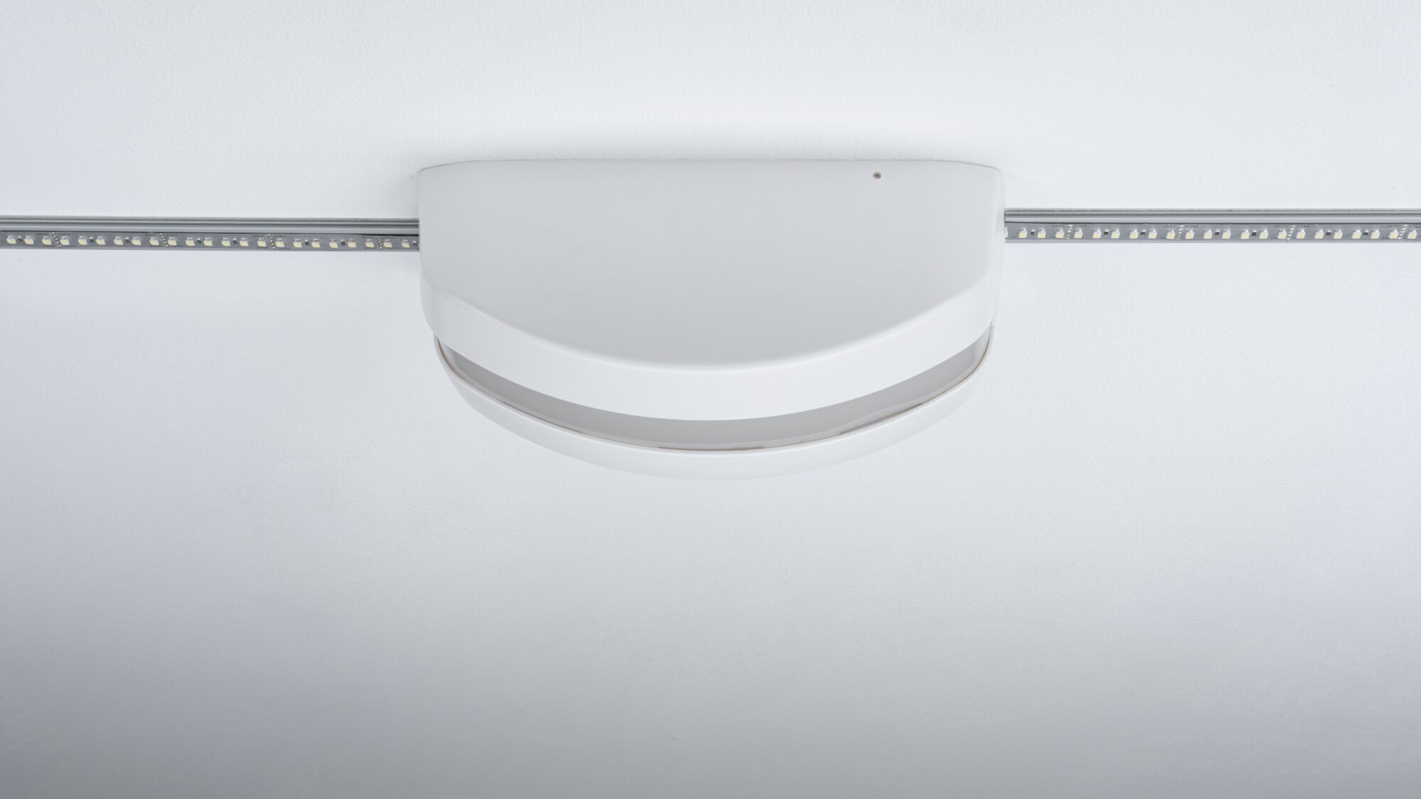 White plastic LED ceiling light sensor for modern indoor lighting control and automation