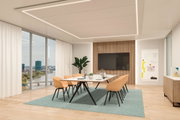 Modern office with rectangular table, orange chairs and LED ceiling lighting in bright room