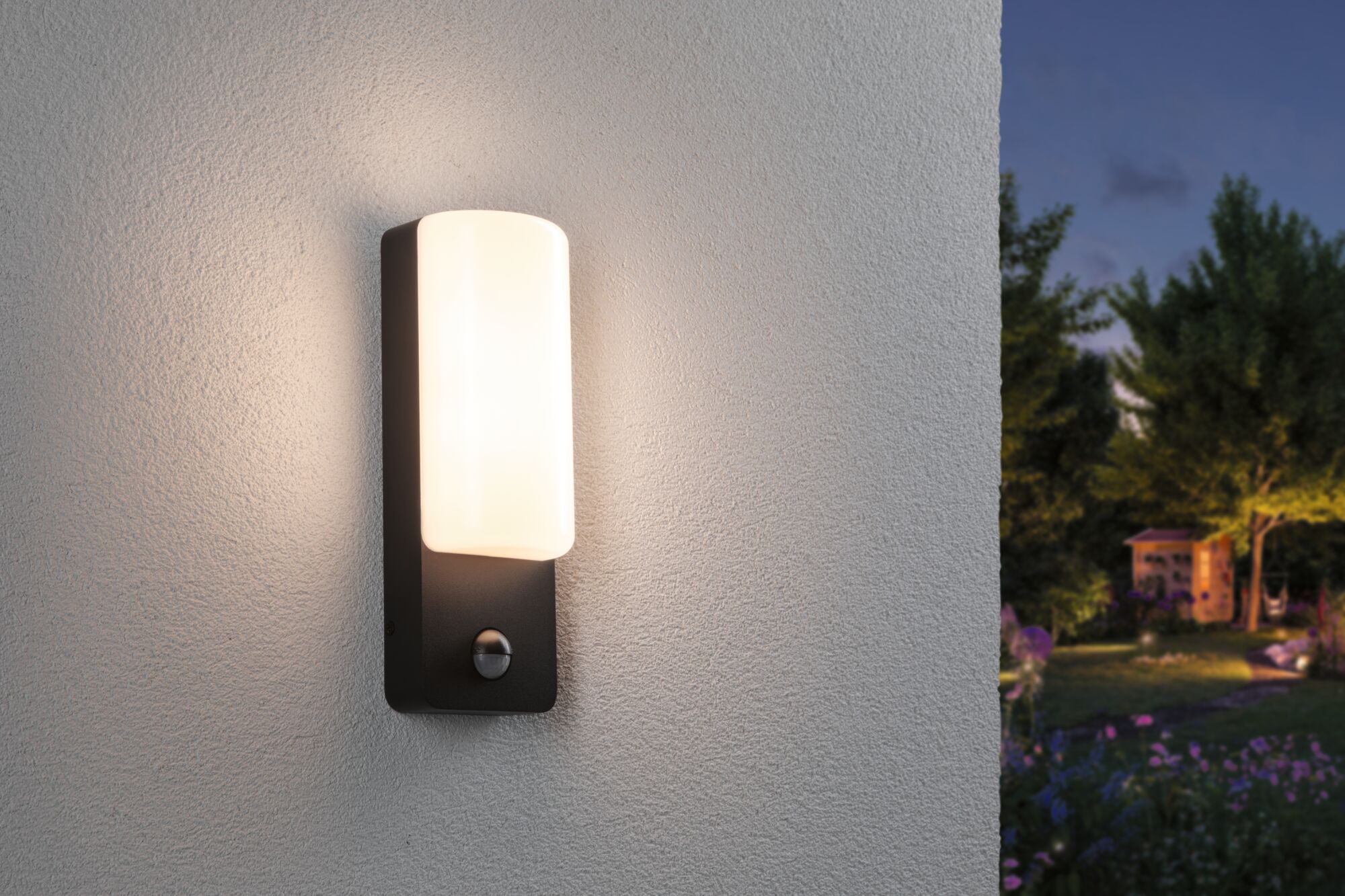 Modern outdoor wall light with black metal frame and white glass, perfect for garden lighting.