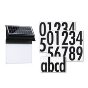 Black solar light with white panel and black number and letter stickers for house numbering.