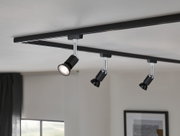 Black metal LED ceiling track with three adjustable spotlights for modern interior lighting.