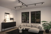 Modernes Wohnzimmer mit schwarzer Paulmann LED-Schienenbeleuchtung an der Decke und grauem Ecksofa.