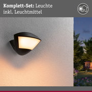 Schwarze Außenwandleuchte mit warmweißem Licht an weißer Wand, moderne Gartenbeleuchtung