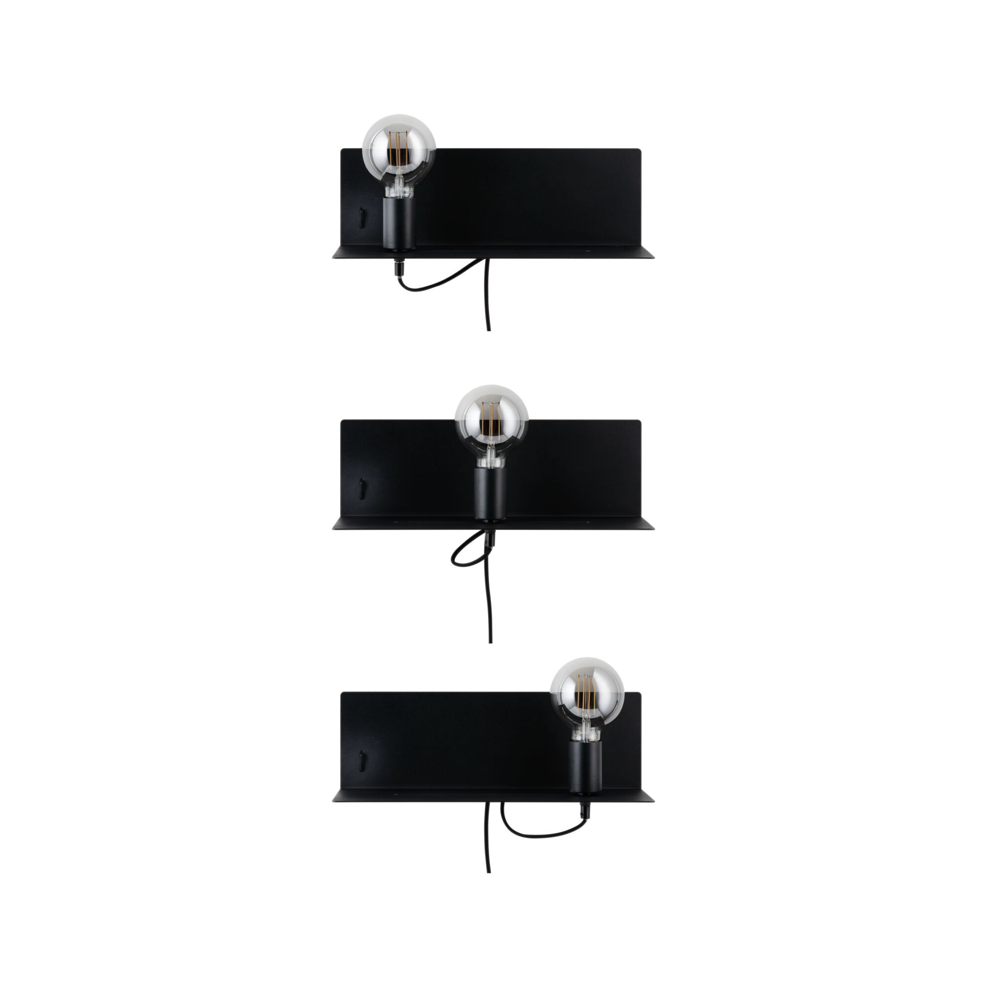 Three black metal wall lamps with exposed bulbs and cords for modern indoor lighting design