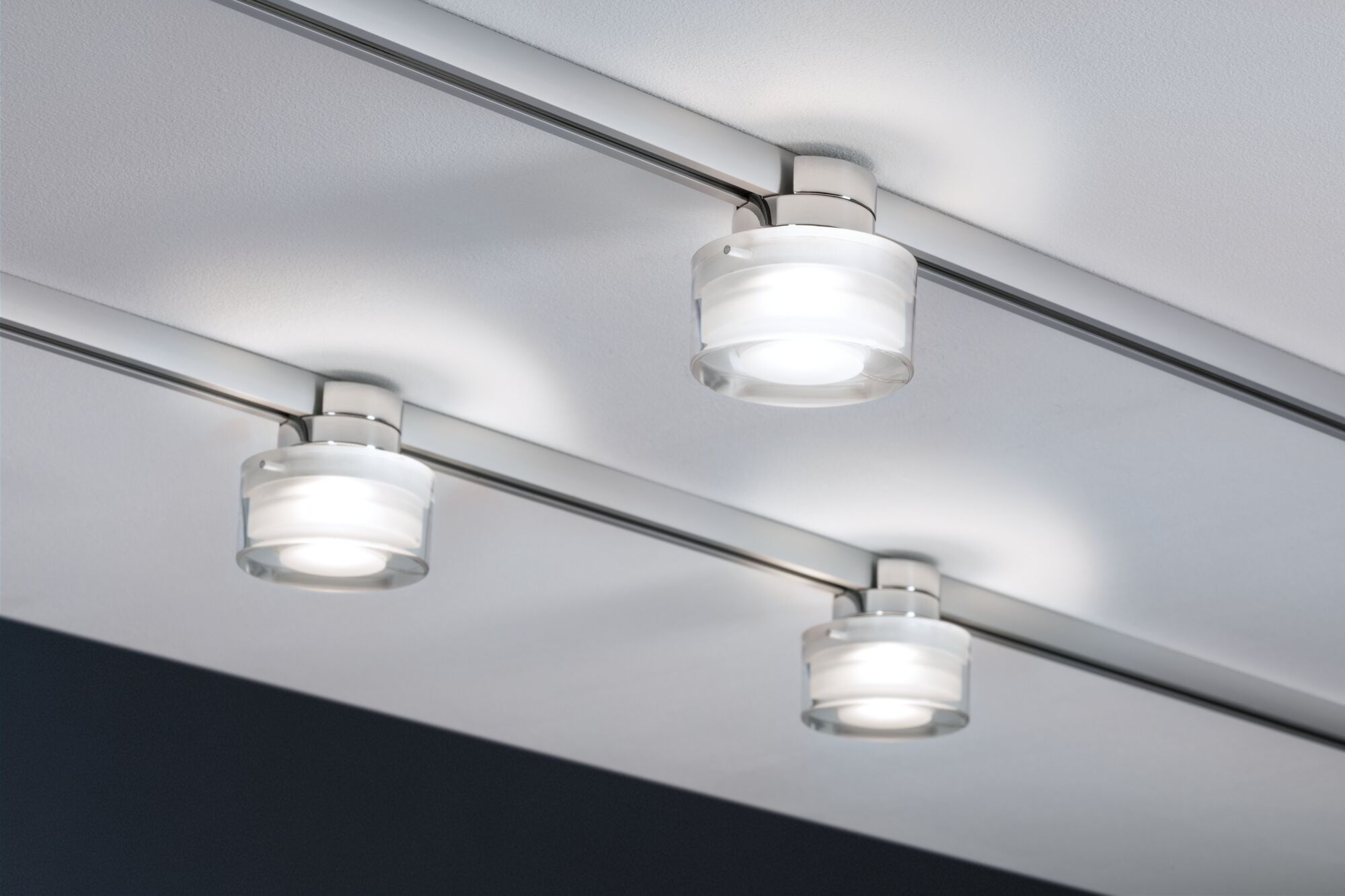 Three modern ceiling spotlights with glass and metal in white and silver for flexible room lighting