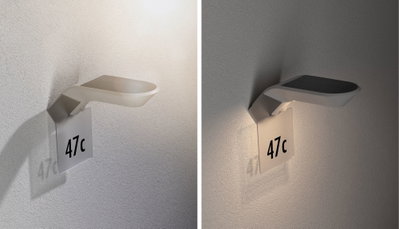 Modern white LED wall light with house number 47c, energy-saving outdoor lighting fixture