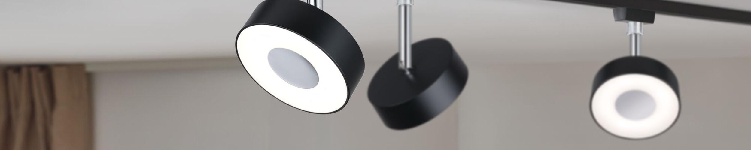 Zwarte URail LED-plafondspots met rond ontwerp en warm wit licht voor moderne interieurs