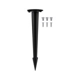 Black plastic ground spike with six silver screws for outdoor lighting installation.
