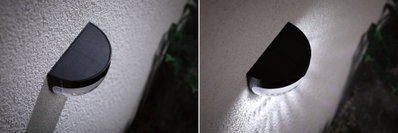Applique murale solaire noire en plastique semi-circulaire sur mur blanc, vue jour et nuit avec éclairage LED.