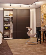 Modern bedroom with brown wooden sliding door wardrobe and beige designer chair with metal frame