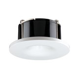 Round white LED recessed light housing with black plastic and metal heat sink for ceiling.