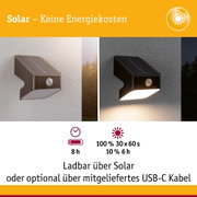 Schwarze Solar-Wandleuchte mit Bewegungsmelder, energiesparend und wetterfest für Außenbereiche