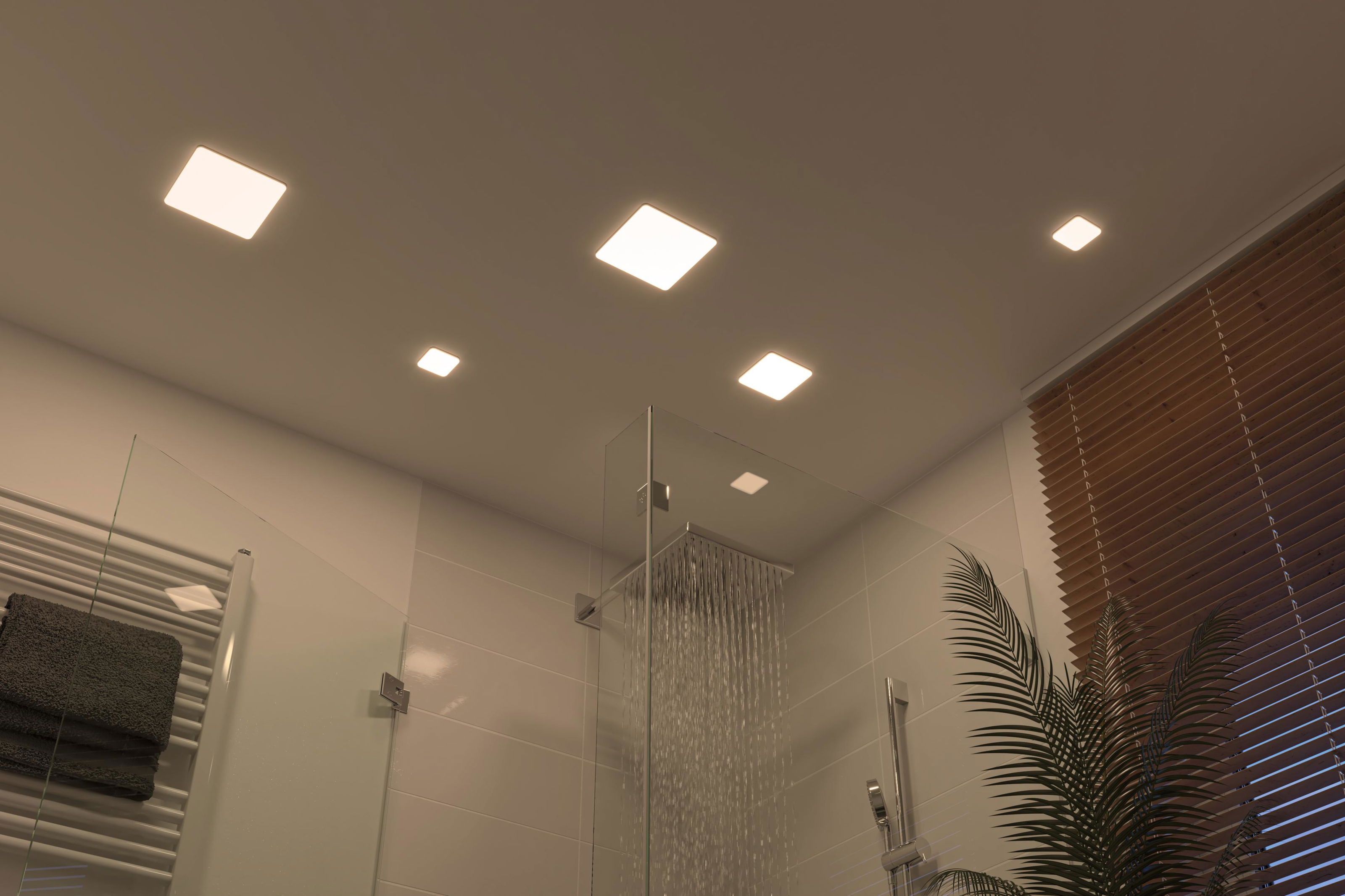 Modern square LED ceiling lights in warm white illuminate a bathroom with shower and wooden blinds.