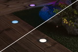 Recessed LED garden lights with stainless steel frame on wooden terrace, warm and cool white light