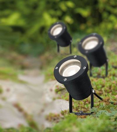 Black metal LED garden spotlights with warm white light for outdoor lighting in green areas