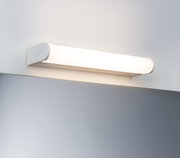 Witte LED-wandlamp van kunststof boven een spiegel voor moderne badkamerverlichting