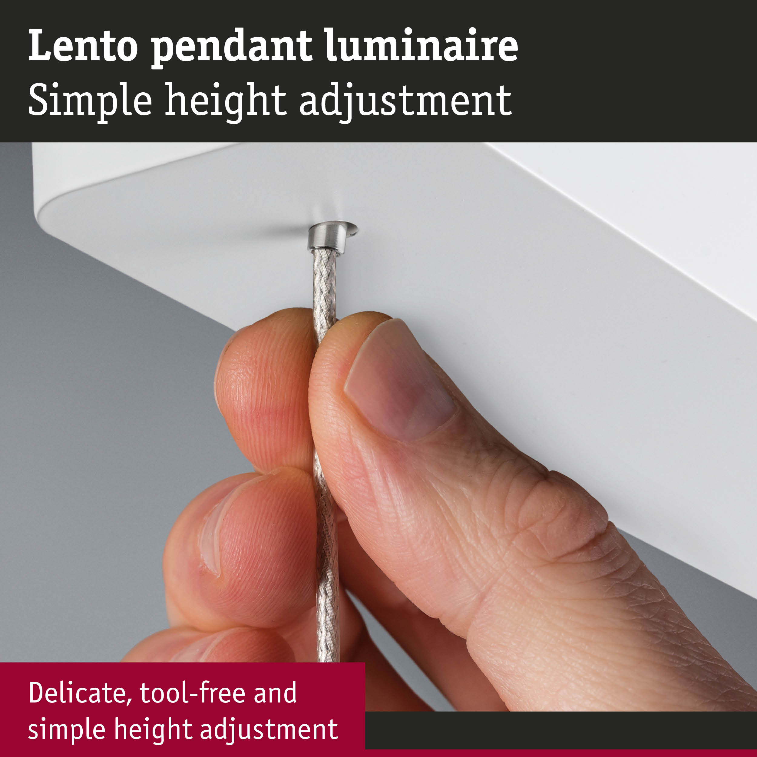 Close-up of hand adjusting silver cable on white Lento pendant luminaire with simple height adjustment