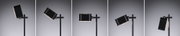 Black metal floor lamp with adjustable rectangular shade and warm white LED light for modern interiors.