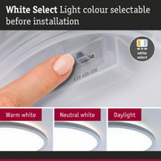 Finger adjusting white light colour before installation showing warm, neutral, and daylight LED options