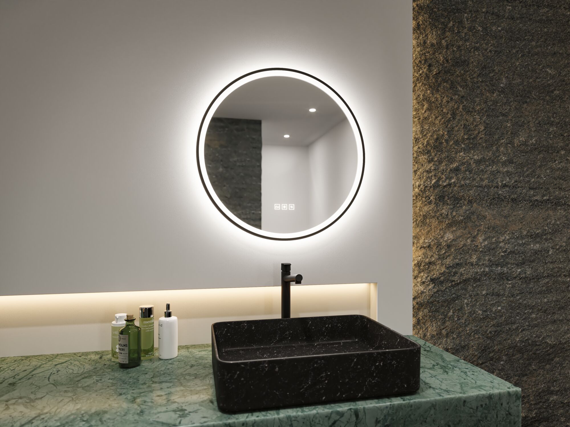 Round illuminated mirror with black marble sink on green stone countertop in modern bathroom